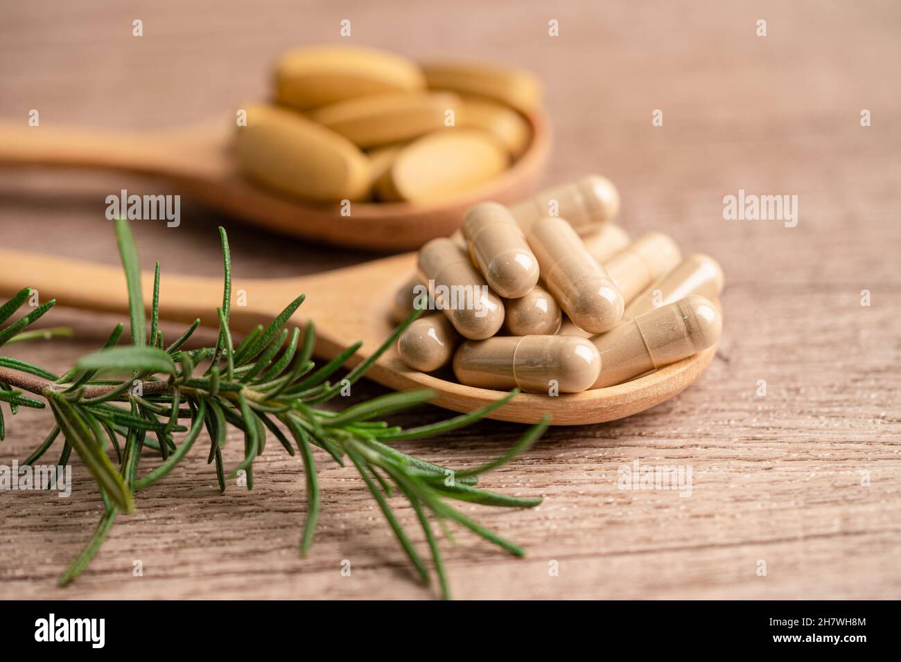 Alternative medicine herbal organic capsule with vitamin E omega 3 fish oil, mineral, drug with herbs leaf natural supplements for healthy good life. Stock Photo
