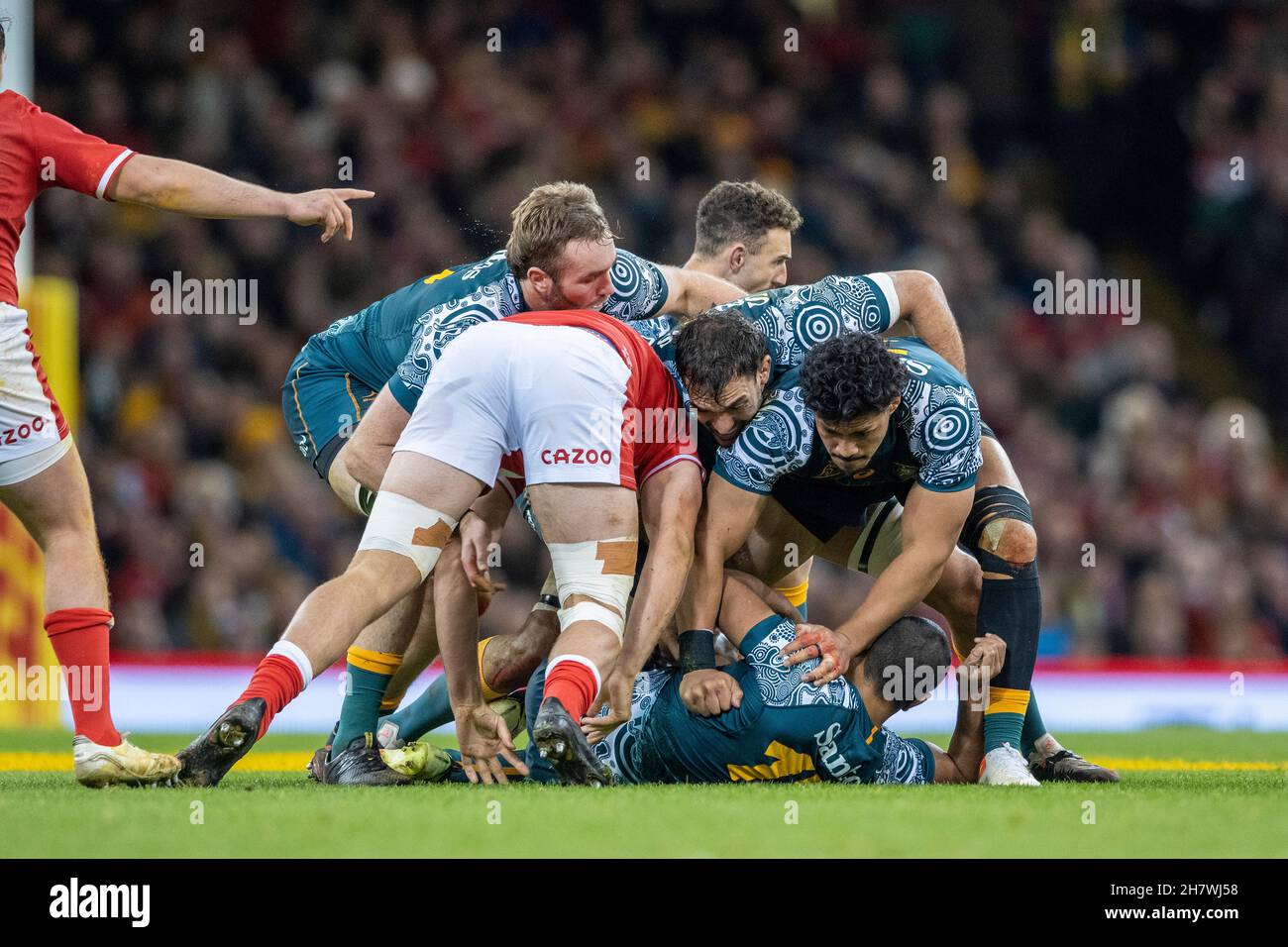 Welsh flanker, Ellis Jenkins attacks the Wallabies ruck formed by Izack Rodda, Rory Arnold and Pete Samu, who are protecting the tackled full back, Kurtley Beale. Stock Photo