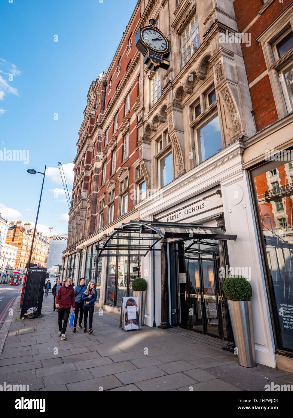 Harvey Nichols, London. Shoppers walking by the entrance to the
