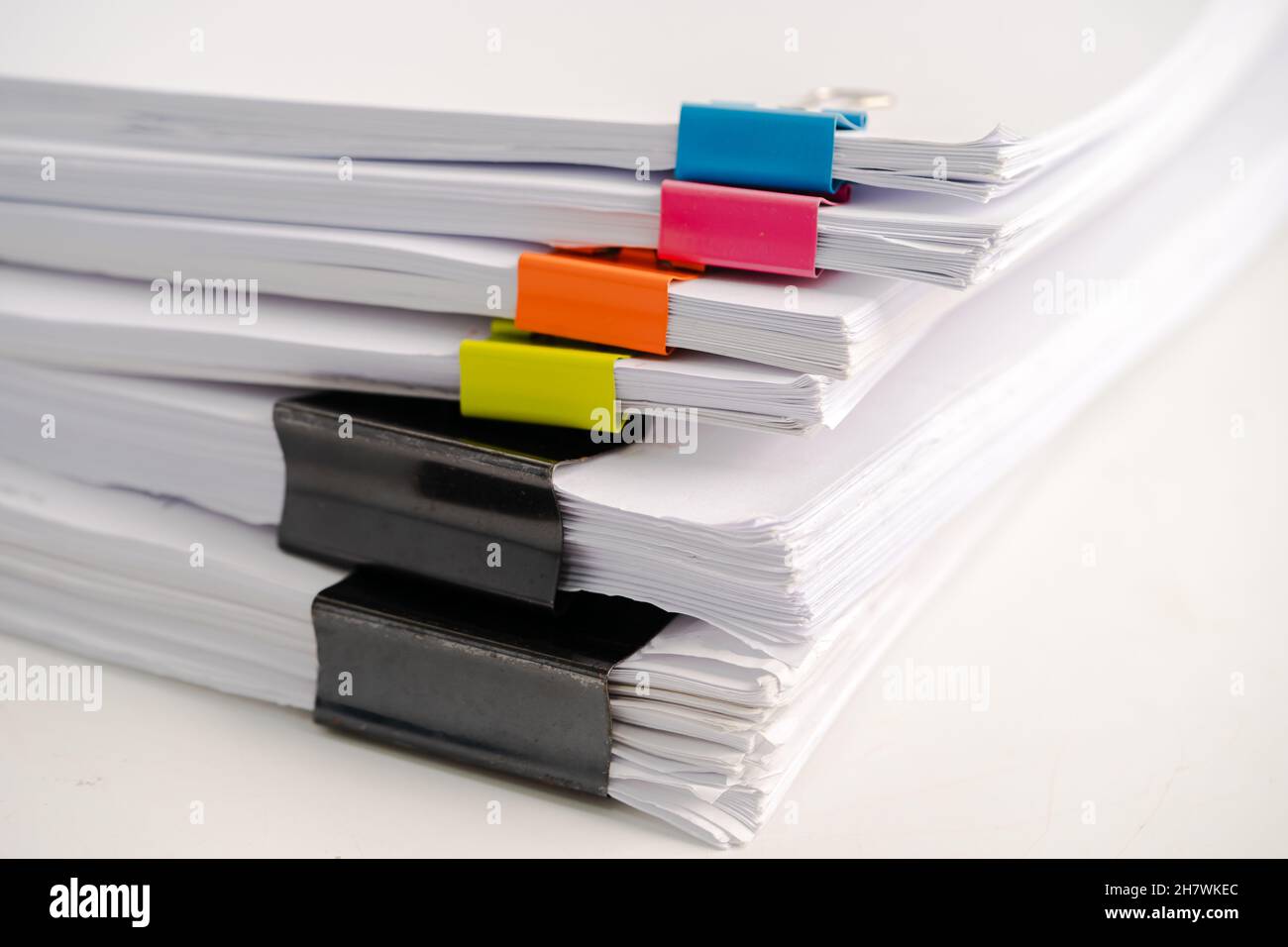 Stack of report paper files in business office clips Stock Photo - Alamy