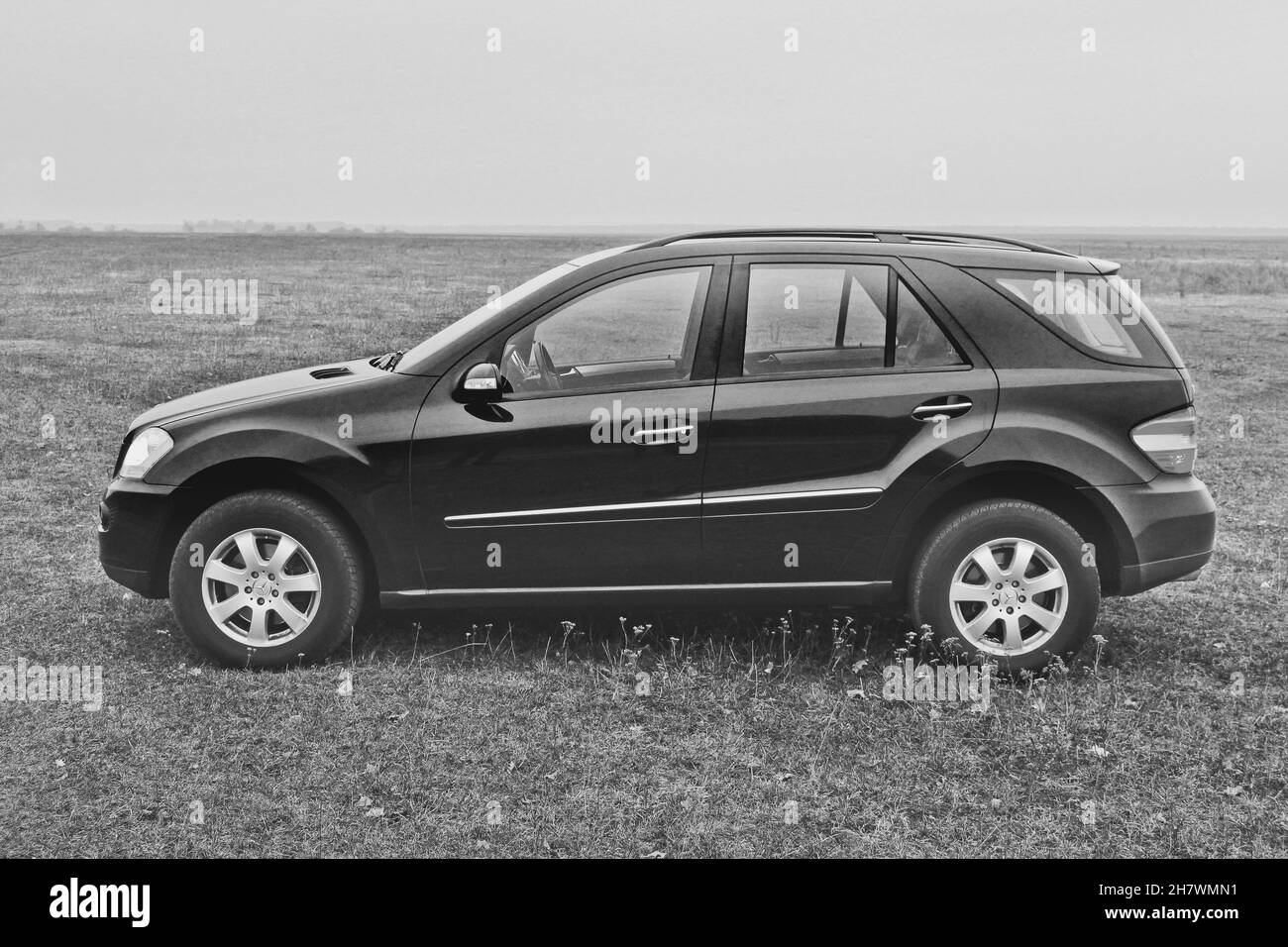 Popelnya, Ukraine - November 19, 2011: Black Mercedes ML class in the field Stock Photo