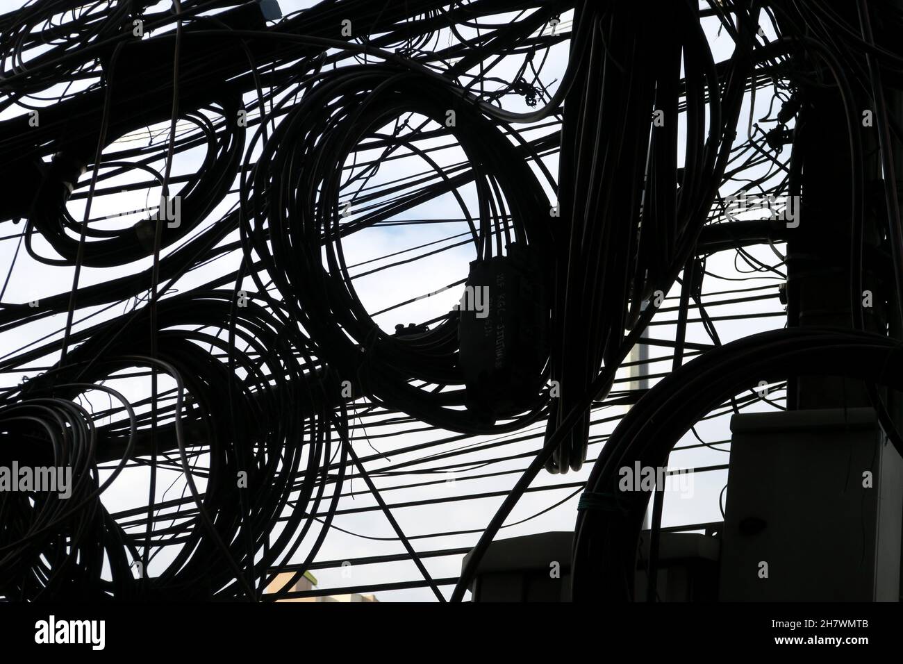 A tangle of overhead cables, Bangkok, Thailand Stock Photo