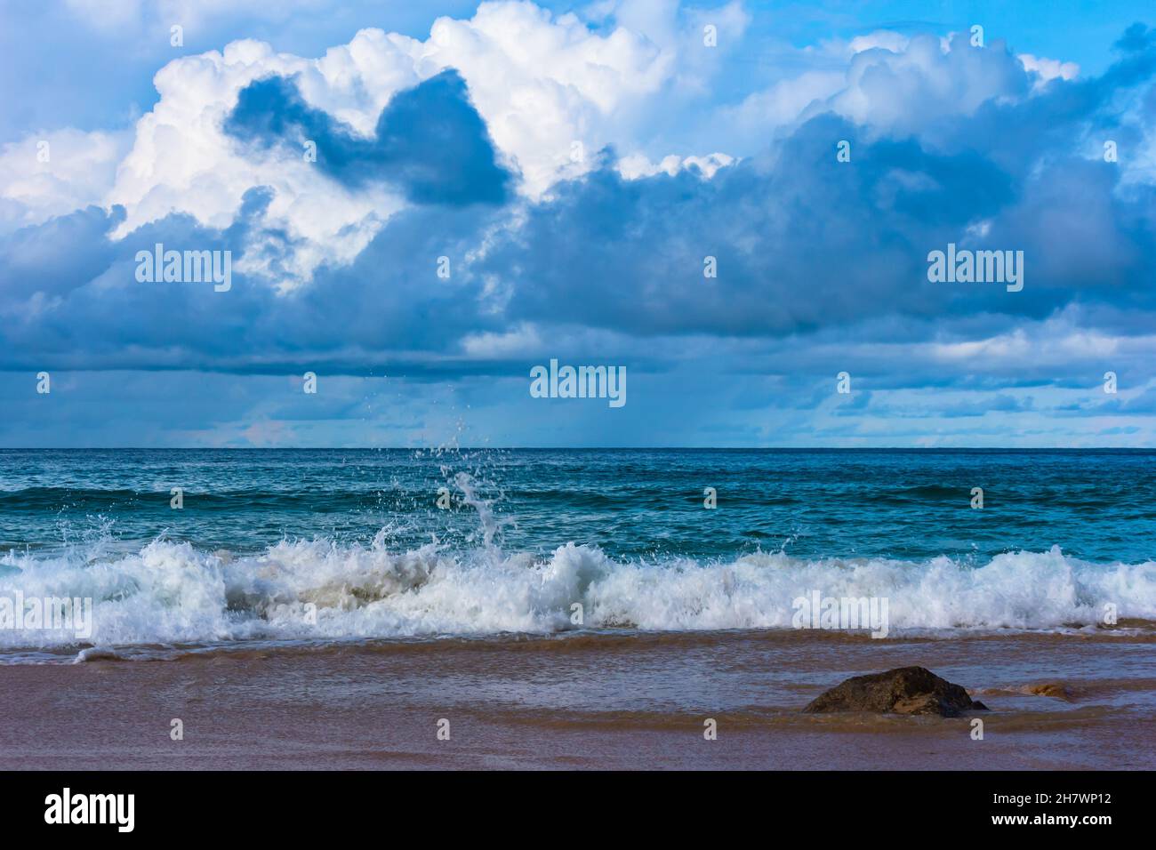 Normal weather after showers huge clouds and waves Stock Photo Alamy