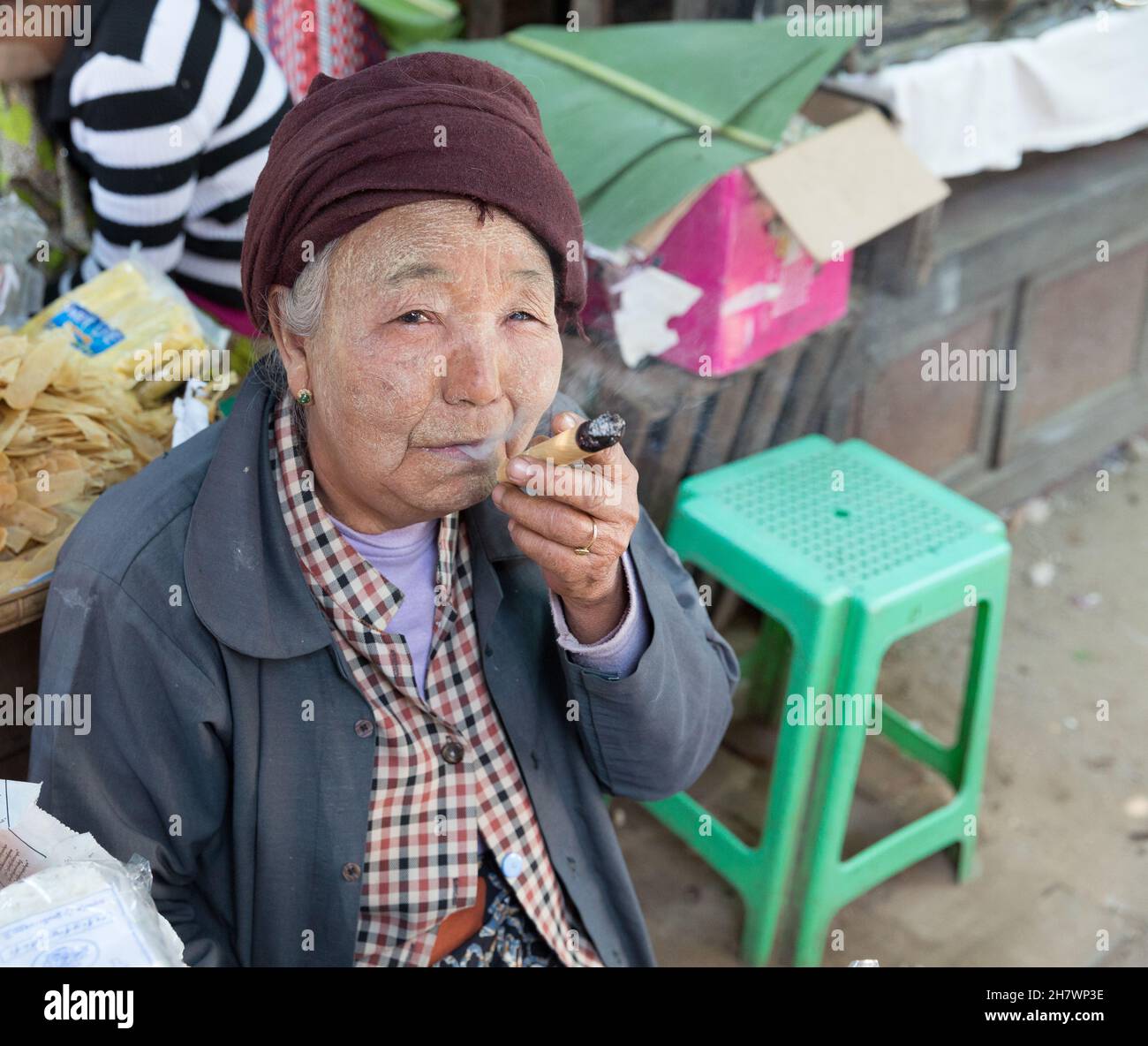 Portrait of old woman smoking cigar in the Nyaung U market Stock Photo ...