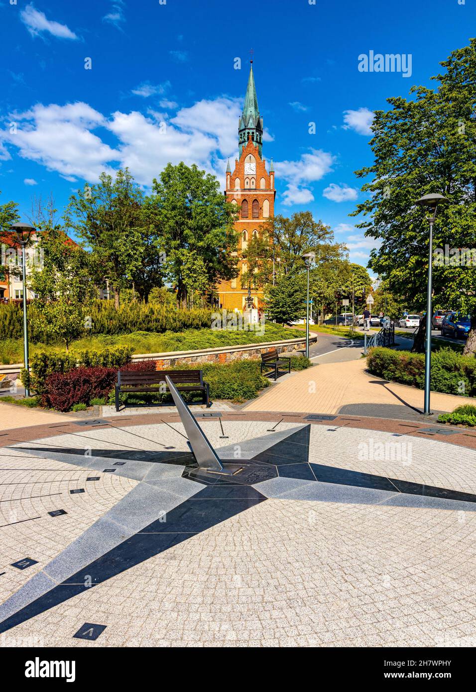 Elk, Poland - June 2, 2021: XIX century Holiest Heart of Jesus neo-gothic church at Wojska Polskiego street with Sundial Park in Elk town in Masuria r Stock Photo