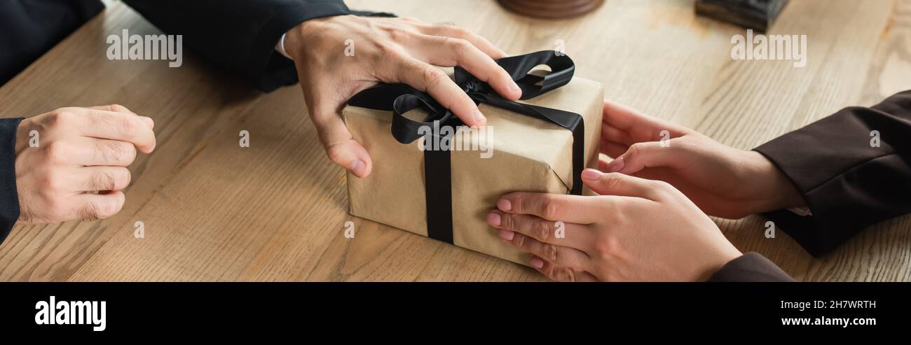 Office man giving gift box hi-res stock photography and images - Alamy
