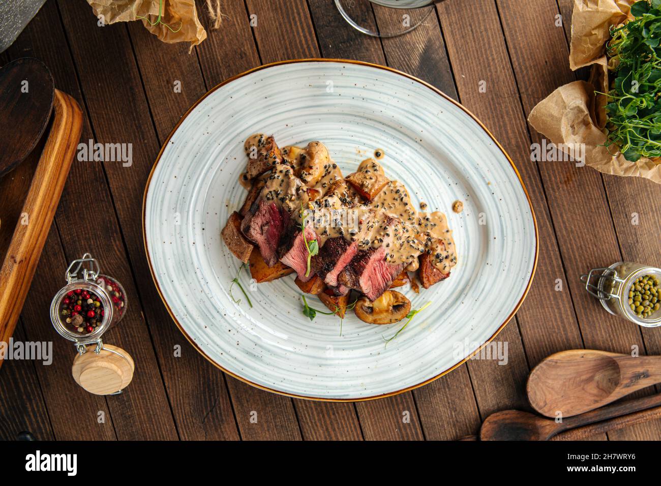 Beef medallions dish with potatoes and mushrooms Stock Photo