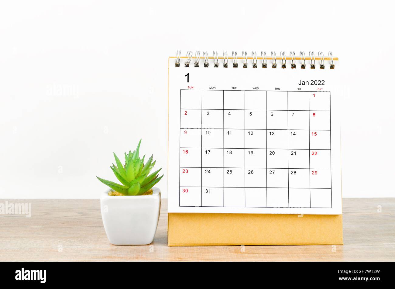 January 2022 desk calendar with plant pot on wooden table Stock Photo ...