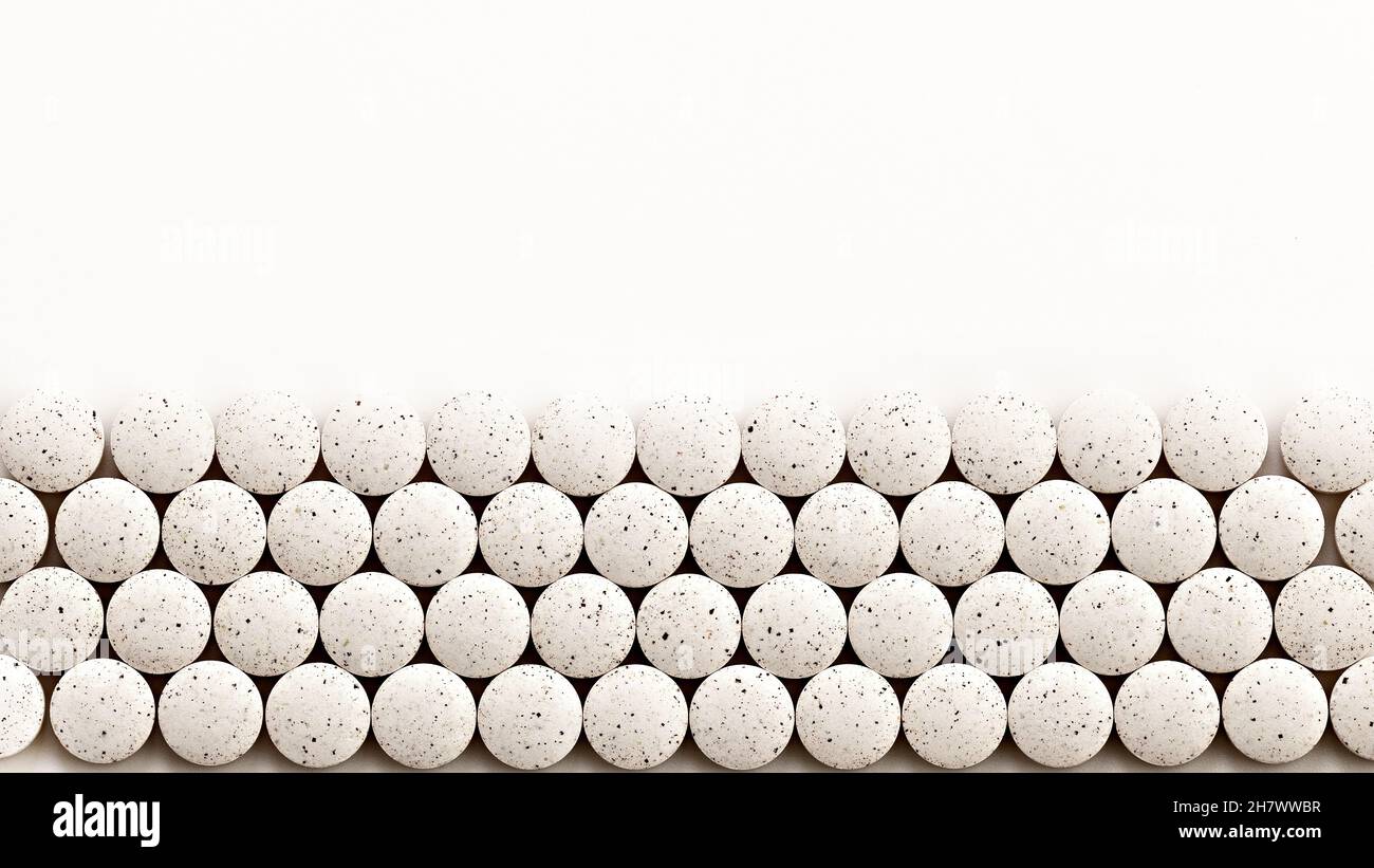 white pills on white background. white pills copy space Stock Photo