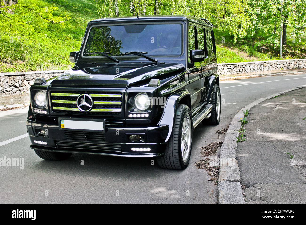 Kiev, Ukraine - April 27, 2014: Black Mercedes-Benz G500 AMG style on the road Stock Photo