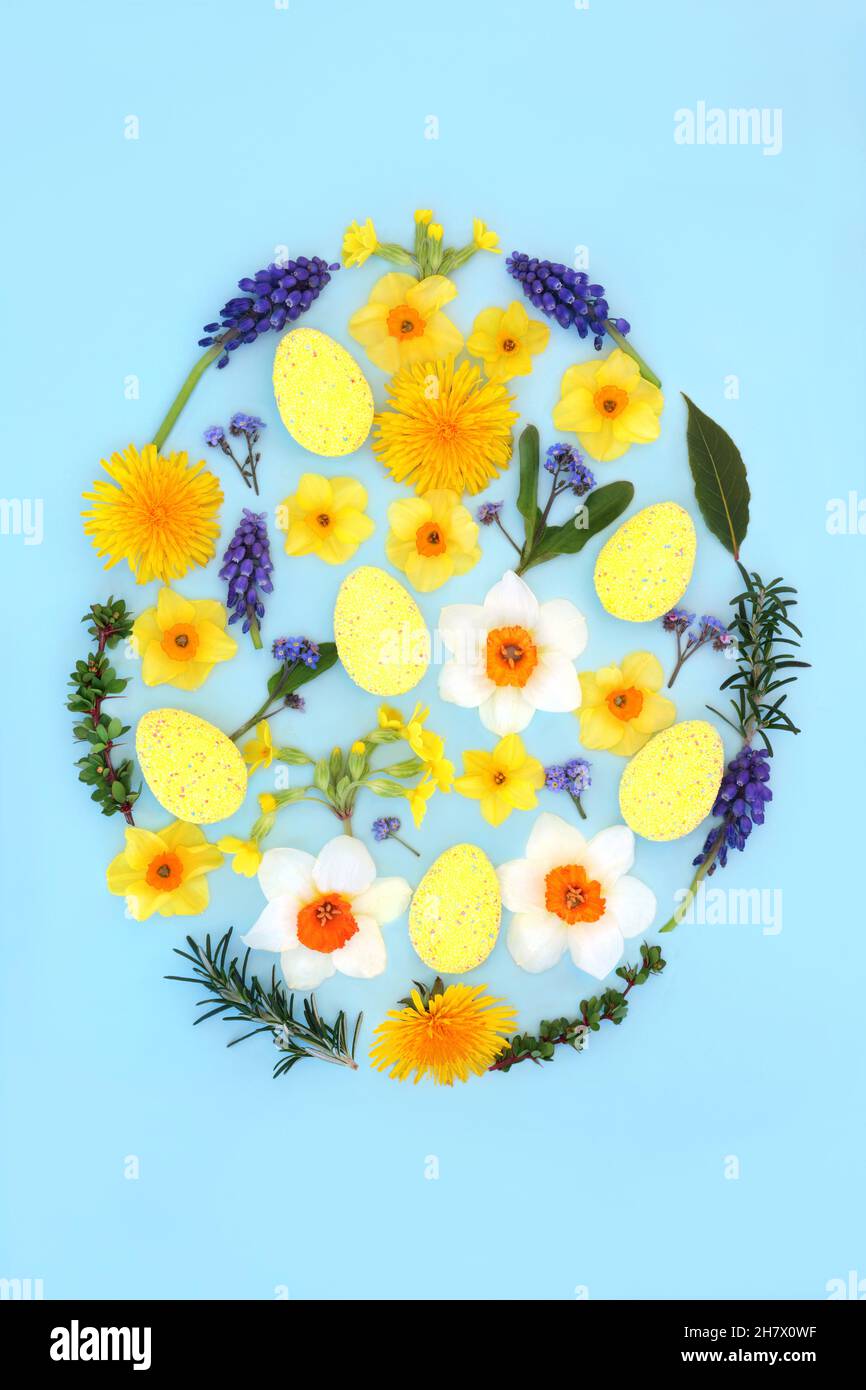 Easter egg concept shape with decorated eggs, spring flowers and leaves ...