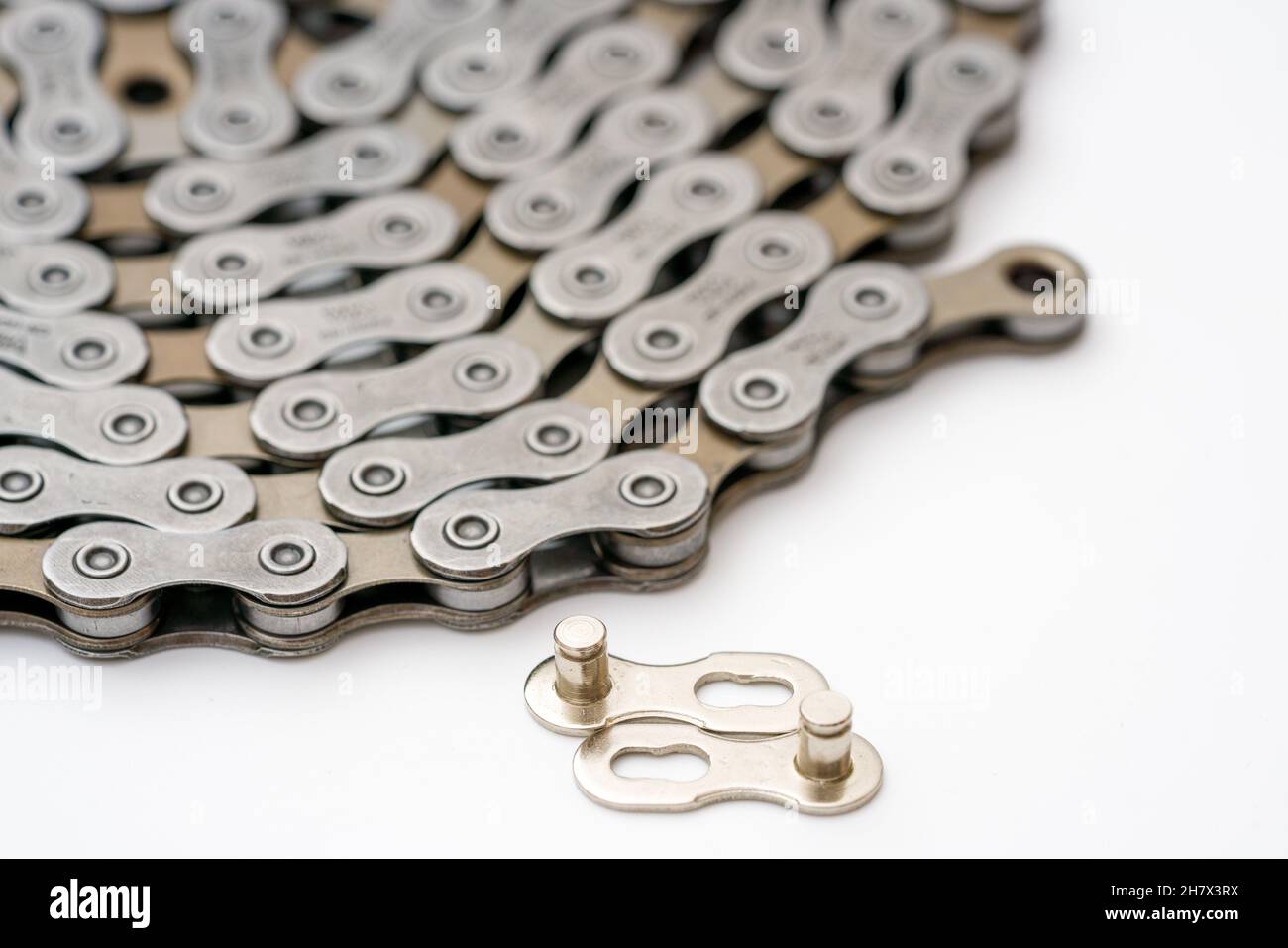 Gears, sprockets and chain of a mountain sports bike on a white background. Bicycle parts Stock