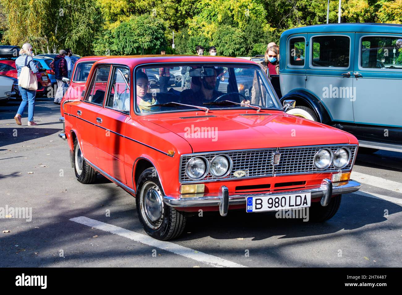 Bucharest, Romania, 24 October 2021: One red Lada vintage car in traffic in a street at an event for vintage cars collections, in a sunny autumn day Stock Photo