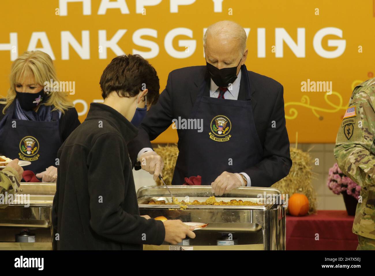 Fort Bragg, United States of America. 23 November, 2021. U.S President Joe Biden and First Lady Jill Biden serve turkey dinner to celebrate an early Thanksgiving with service members at Fort Bragg November 22, 2021, in Fort Bragg, North Carolina. Credit: Spc. Casey Brumbach/U.S. Army/Alamy Live News Stock Photo