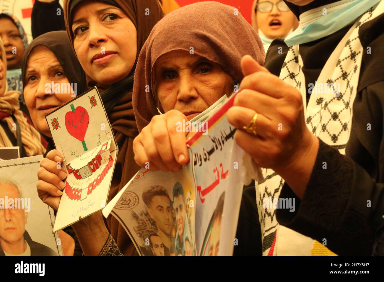 Palestinians join a protest inside the headquarters of Red Cross and demand the corpses of Doihems dead held by Israeli, in Gaza City on Nov 22, 2021. Stock Photo