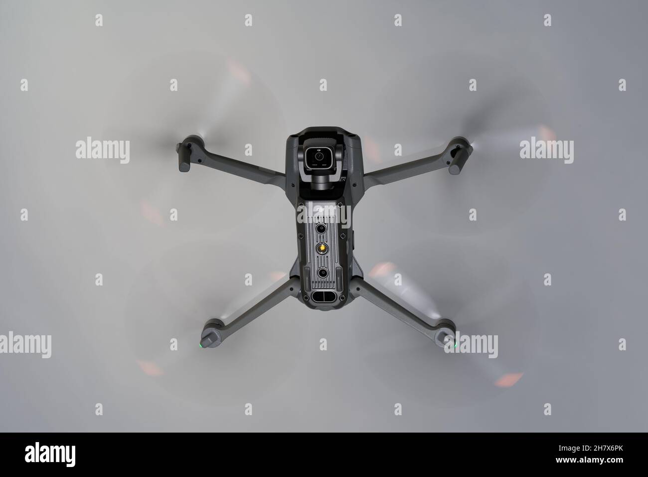 Nürtingen, Germany - June 26, 2021: Drone air 2s from dji hovers in front of gray sky. The 1 inch camera sensor is pointed downwards. Up view. Stock Photo