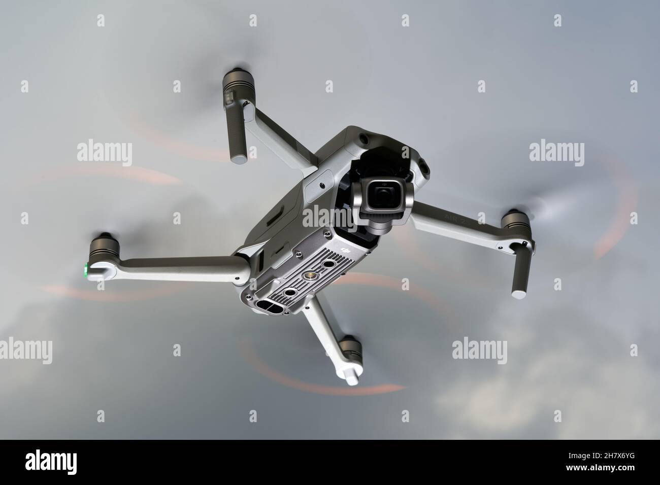 Nürtingen, Germany - June 26, 2021: Drone air 2s from dji hovers in front of gray sky. The flying object is moved in the air by 4 propellers and is eq Stock Photo