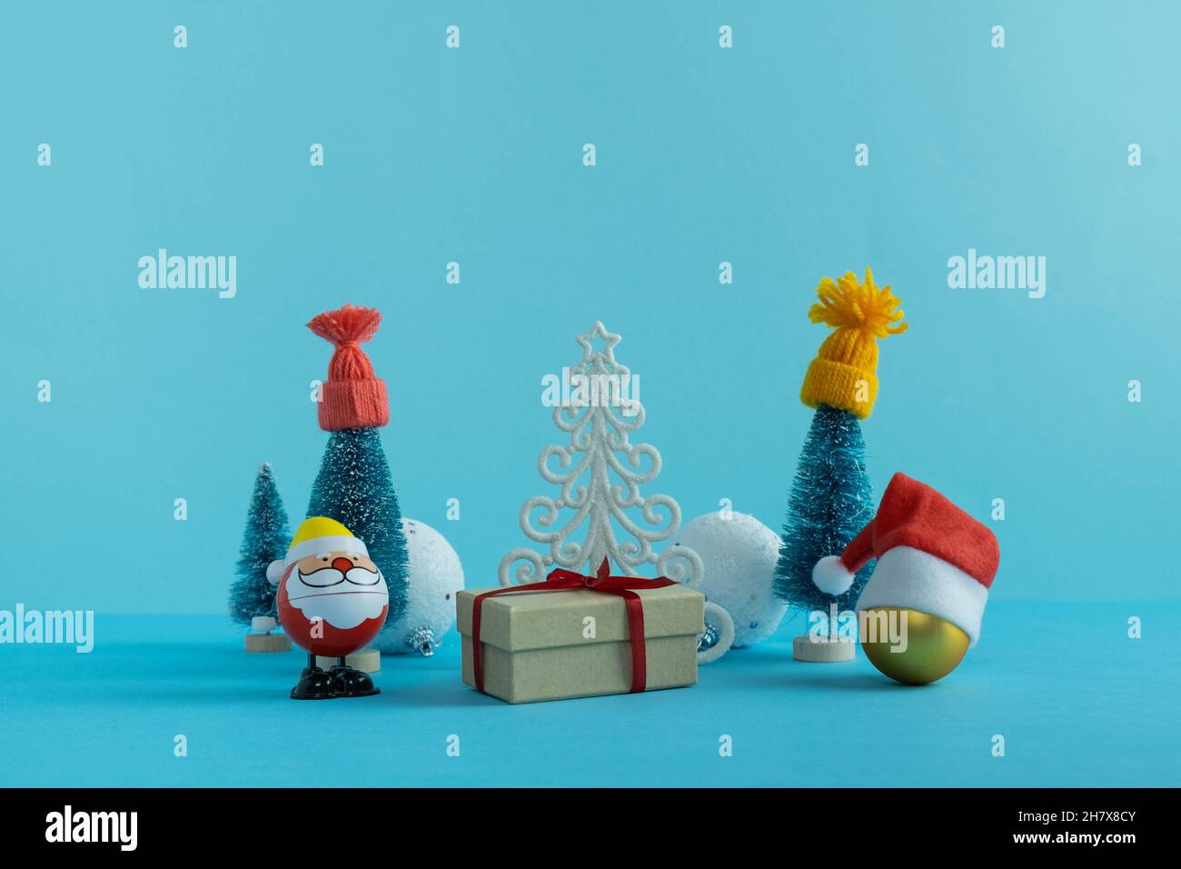 Christmas Santa Claus In July Sales 2022 Santa Claus And Christmas Trees In Winter Hats With Gifts. Christmas Ball  In Santa Hat. Merry Christmas. Happy New Year 2022 Stock Photo - Alamy