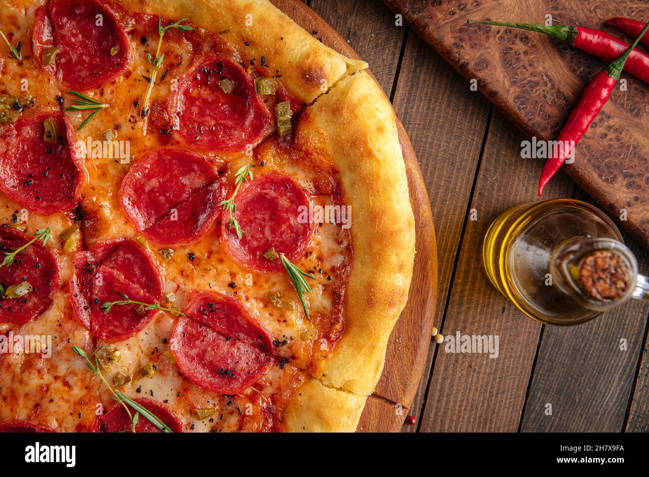 Pepperoni pizza with spicy salami and herbs Stock Photo Alamy