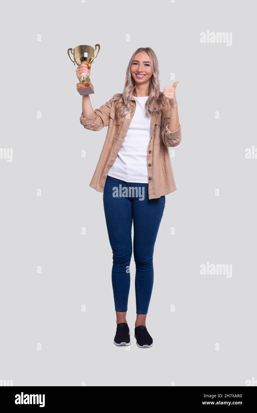 Girl holding trophy hires stock photography and images Alamy