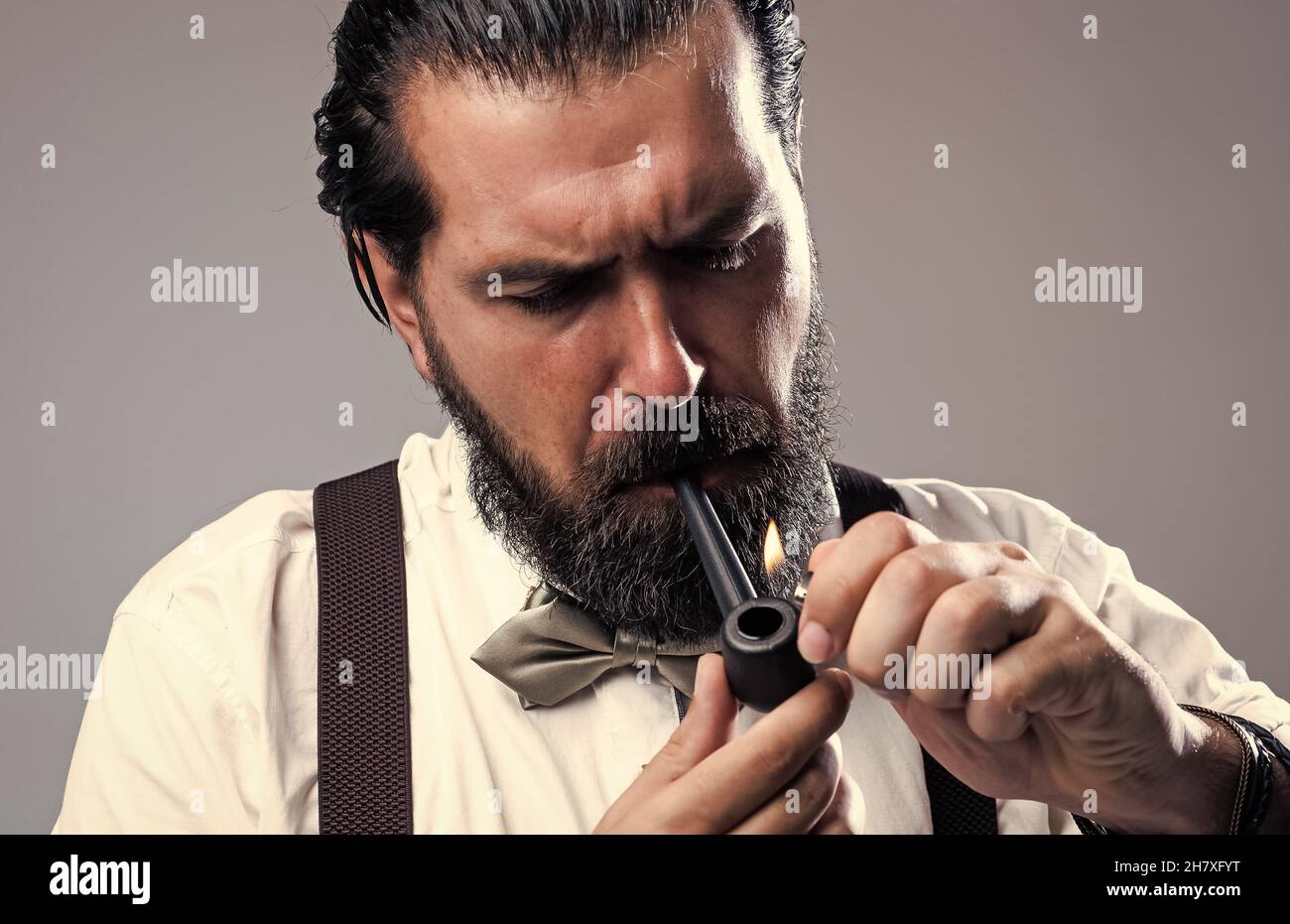 old fashioned bearded hipster smoke pipe. brutal handsome man with  moustache smoking. mature businessman in retro style. masculinity and  charisma Stock Photo - Alamy