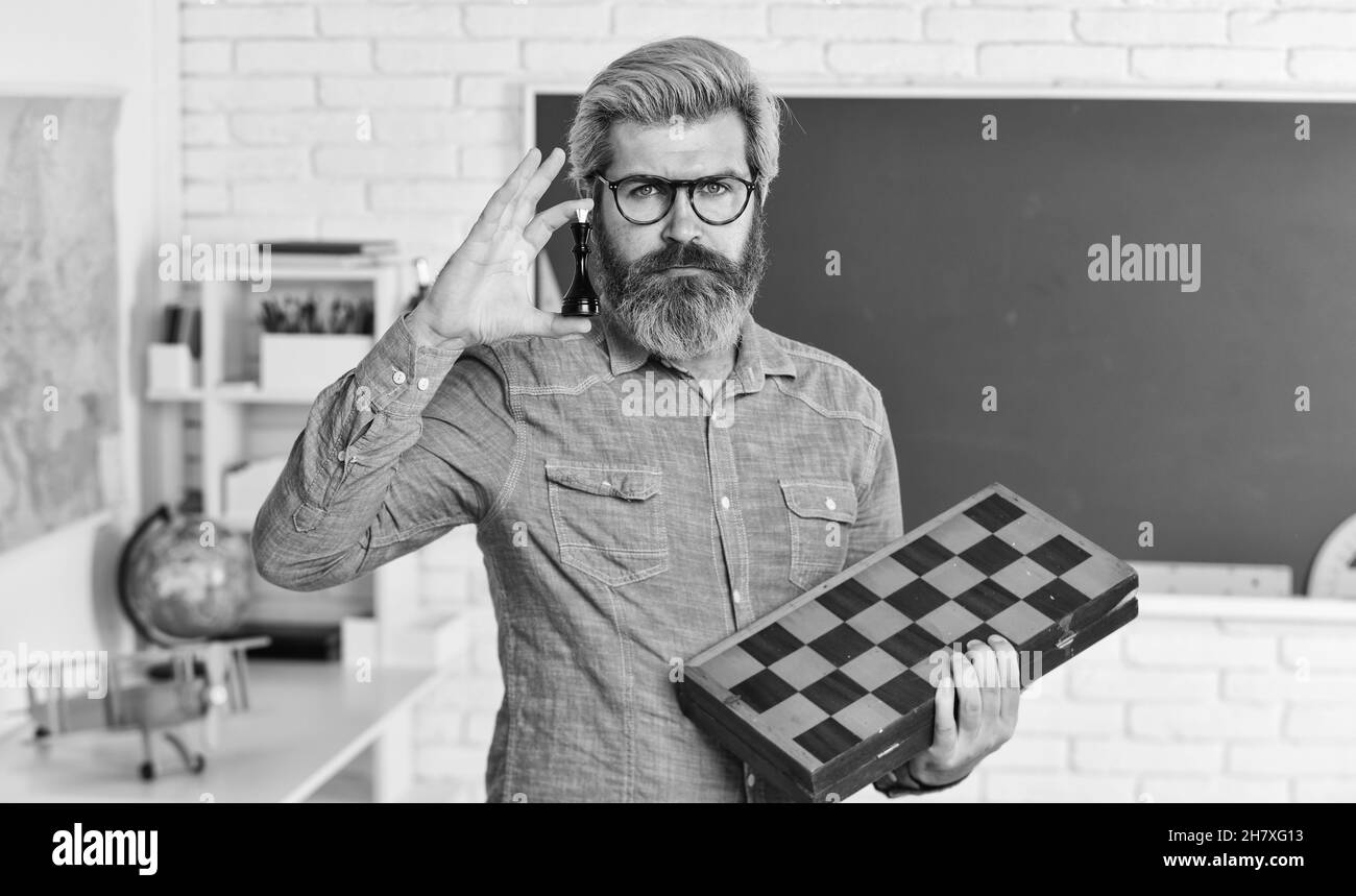 Intellectual game. Board game. Man playing chess. Chess lesson