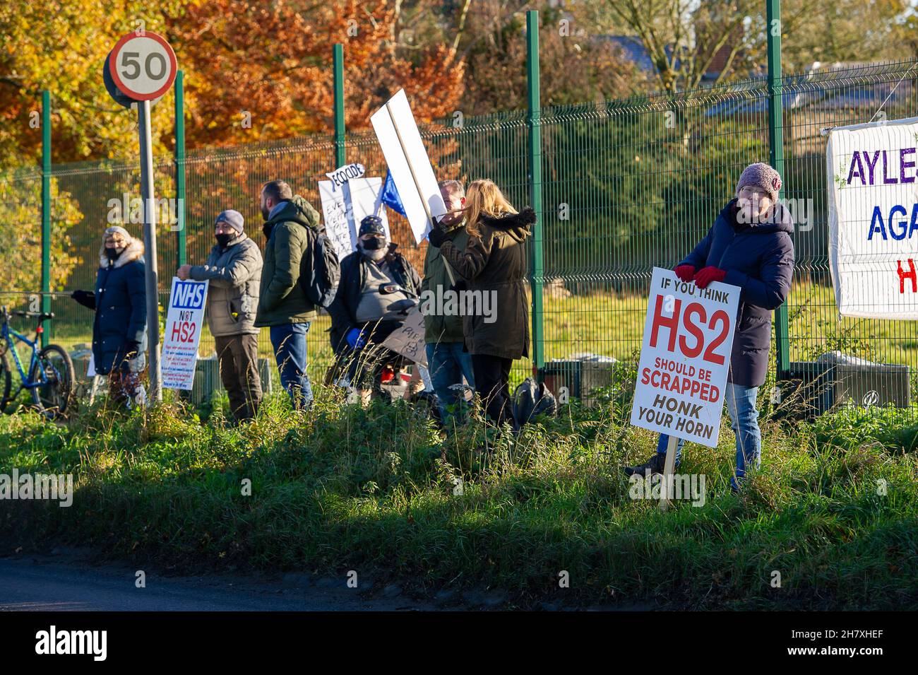Aylesbury, Buckinghamshire, UK. 25th November, 2021. Anti HS2 protesters were protesting along the Oxford Road today in Aylesbury about HS2 allegedly committing wildlife crimes as HS2 have felled mature trees that they believe had hibernating bats roosting in them. Although the Eastern Leg of the HS2 High Speed Rail has been cancelled by Boris Johnson, HS2 Ltd are continuing with their construction of Phase 1 of the HS2 High Speed Rail from London to Birmingham which is destroying swathes of the Chilterns, an Area of Outstanding Natural Beauty. Credit: Maureen McLean/Alamy Live News Stock Photo
