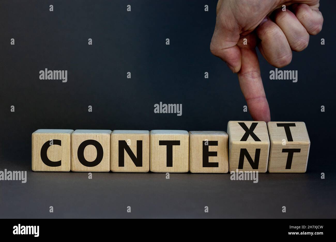 Content And Context Symbol Businessman Turns Wooden Cubes And Changes Content And Context Symbol Businessman Turns Wooden Cubes And Changes