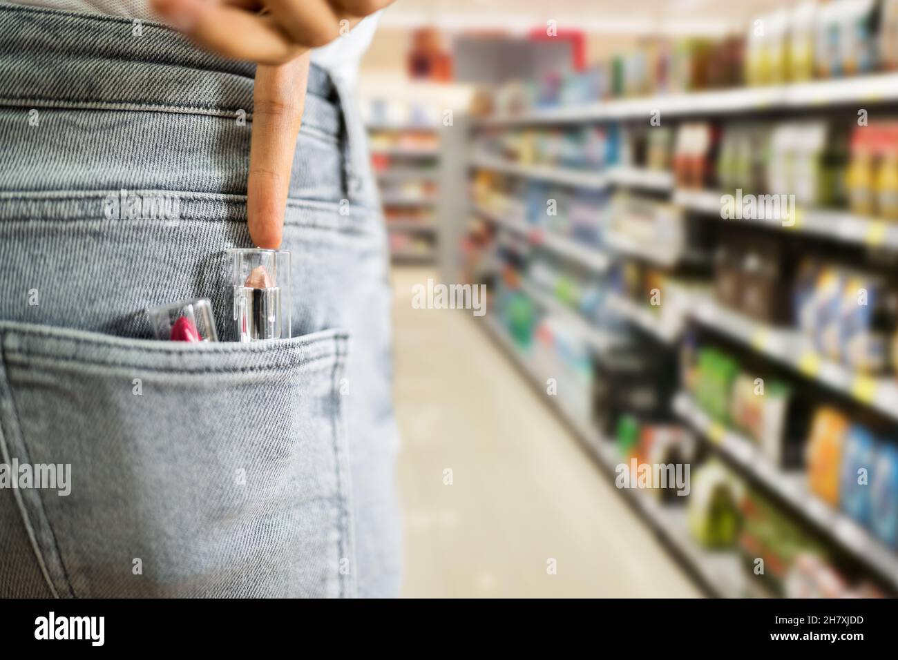 Woman Stealing Lipstick In Retail Store. Shoplifting Theft Crime Stock