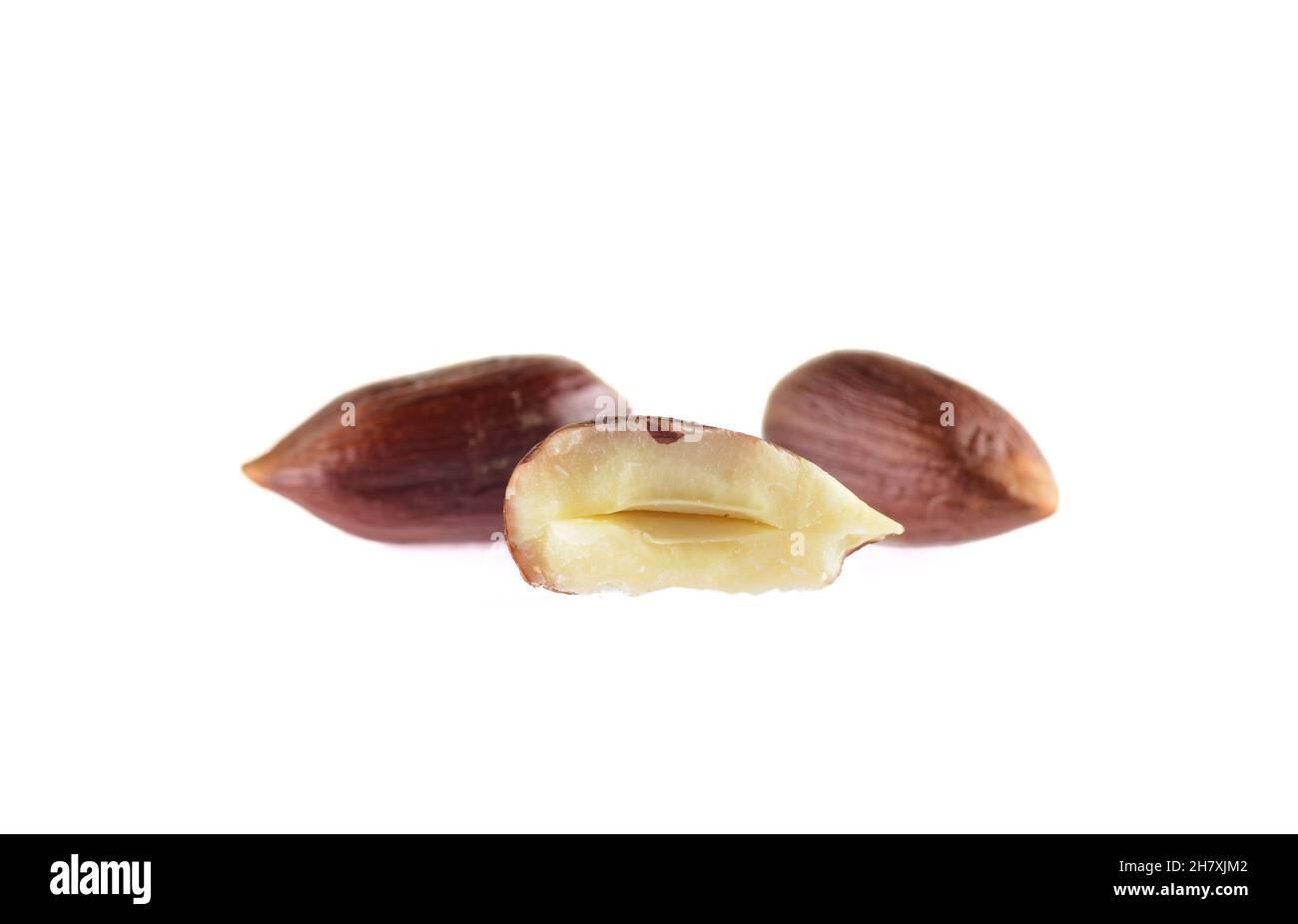 Closeup view of hazelnuts over white background. Stock Photo