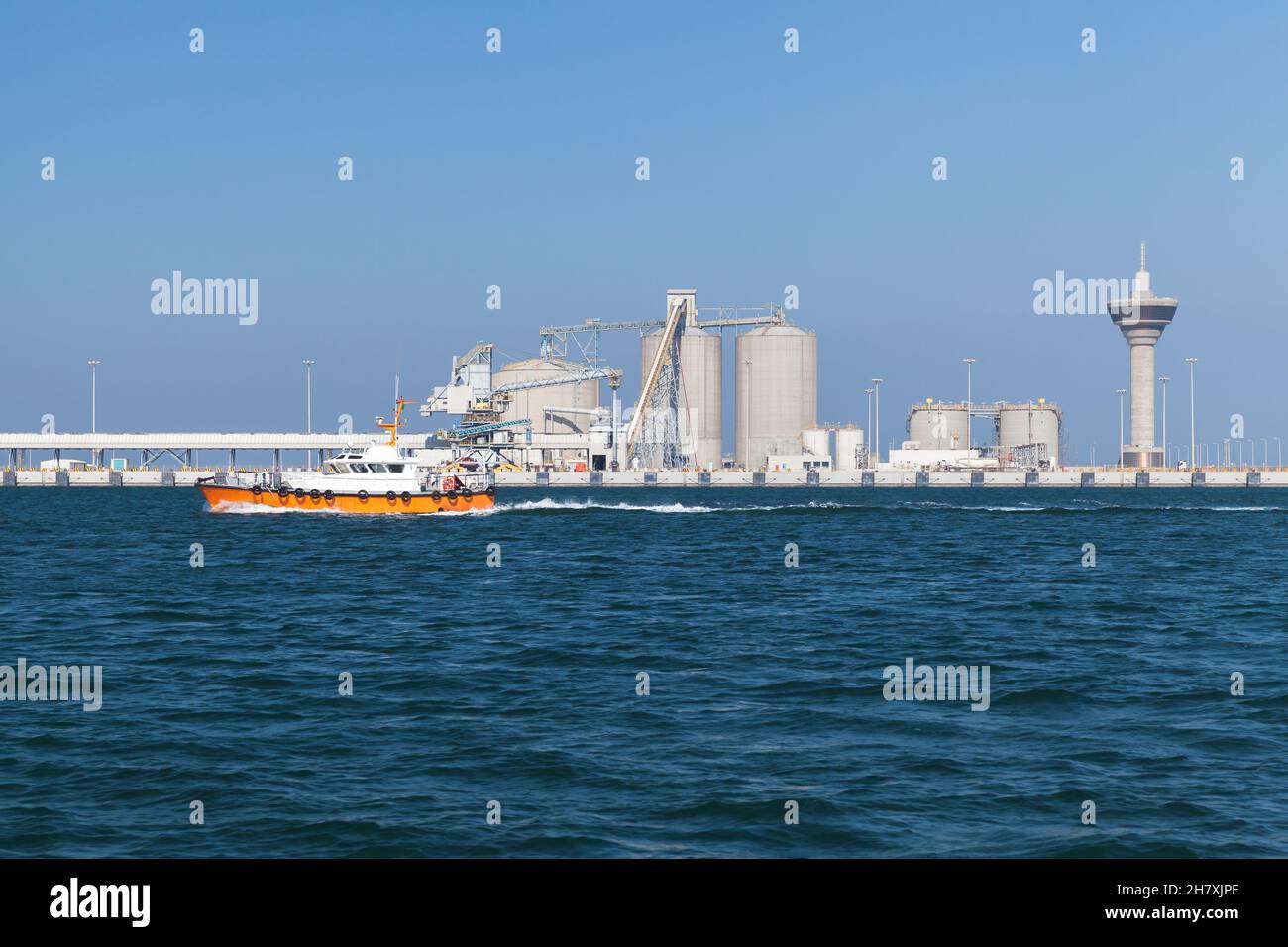 Pilot boat is on the way. Ras Al Khair port is on a background, Saudi ...