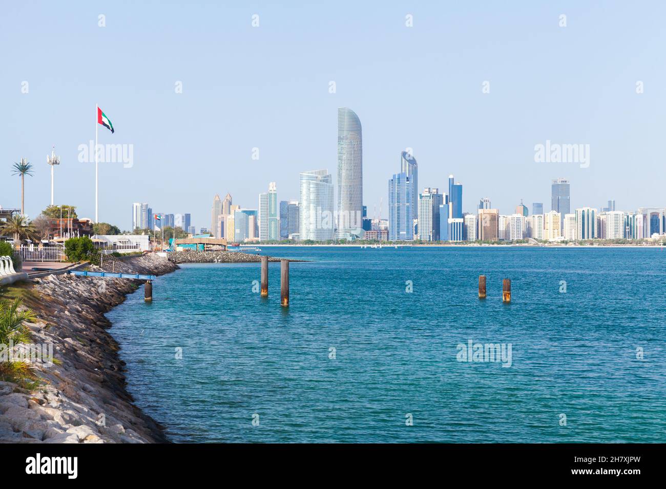 Abu Dhabi, cityscape with tall skyscrapers towers under clear blue sky on a sunny day Stock Photo