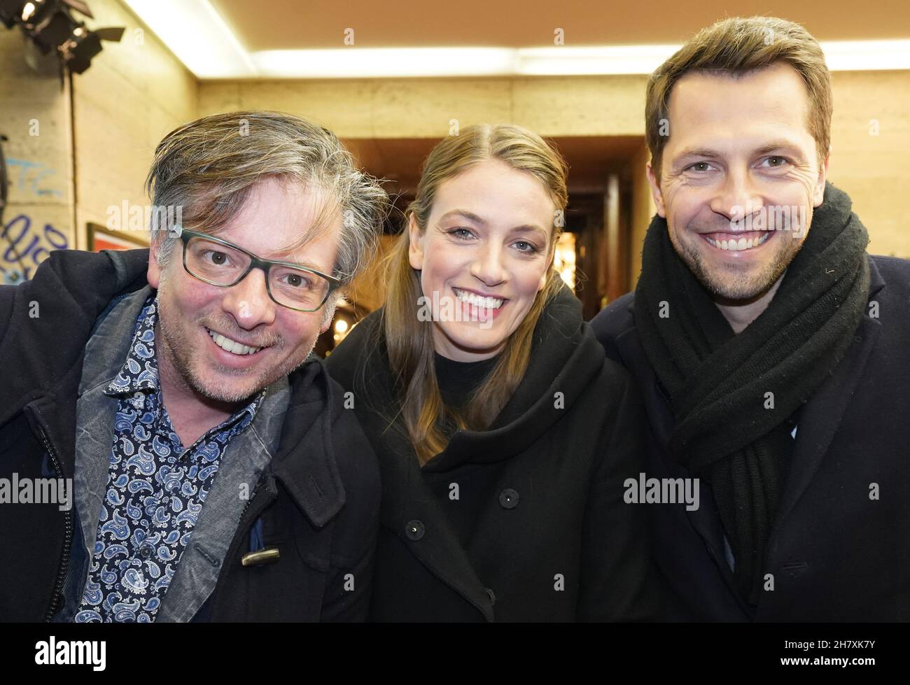 Hamburg, Germany. 25th Nov, 2021. Author Martin Lingnau, (l-r), Tessa Aust, Managing Director of the Schmidt Theater, and Hannes Vater attend the premiere of Varietes at the Hansa Theater. In the evening the new season of the Varietes starts at the Hansa-Theater. Credit: Marcus Brandt/dpa/Alamy Live News Stock Photo