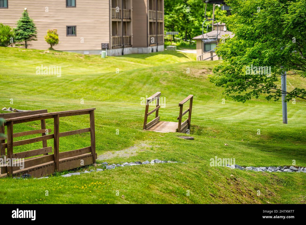 Sugar Mountain ski resort town park with wooden walkway bridge over