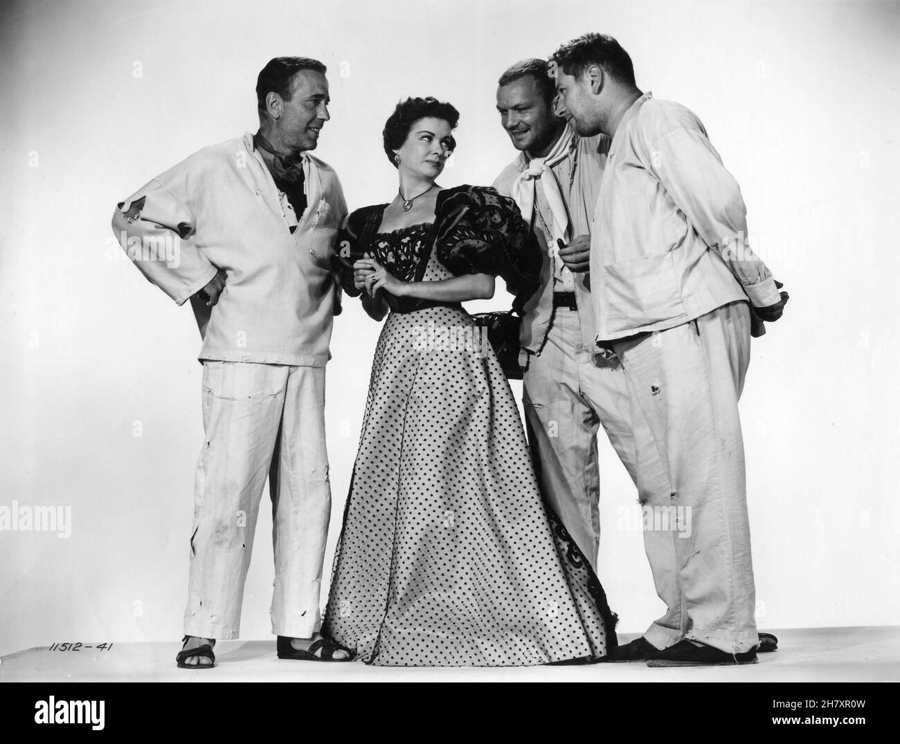 HUMPHREY BOGART JOAN BENNETT ALDO RAY and PETER USTINOV publicity portrait in WE'RE NO ANGELS 1955 director MICHAEL CURTIZ play Albert Husson costume design Mary Grant Paramount Pictures Stock Photo