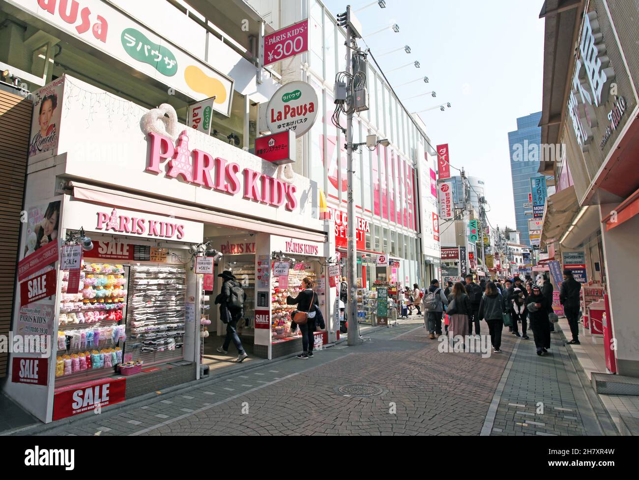 Takeshita Street or Takeshita-dori, a bustling street in the Harajuku part of Tokyo in Japan selling vibrant and extreme fashion, food, and more. Stock Photo