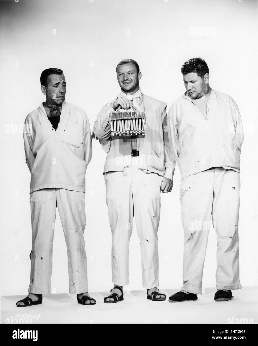HUMPHREY BOGART as Joseph ALDO RAY as Albert and PETER USTINOV as Jules in WE'RE NO ANGELS 1955 director MICHAEL CURTIZ play Albert Husson costume design Mary Grant Paramount Pictures Stock Photo