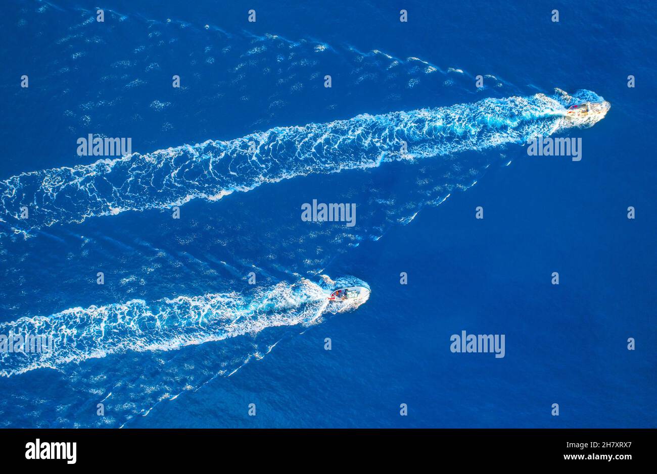 Aerial view of two fishing boats in the sea at sunset in summer Stock ...