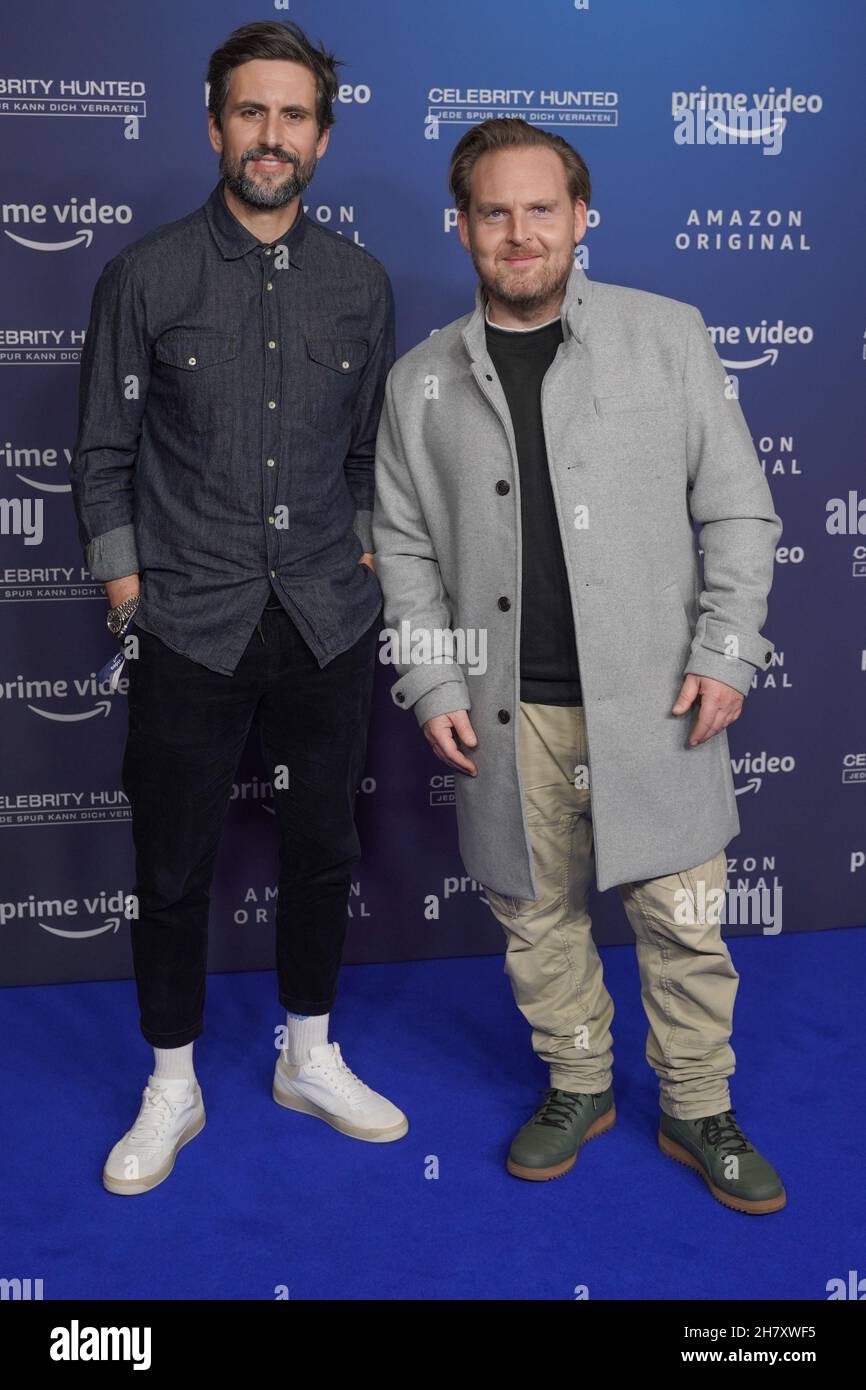 Berlin, Germany. 25th Nov, 2021. Actors Tom Beck (l) and Axel Stein arrive  for a photo session at Zoo Palast on the occasion of the Amazon series  "Celebrity Hunted". A total of