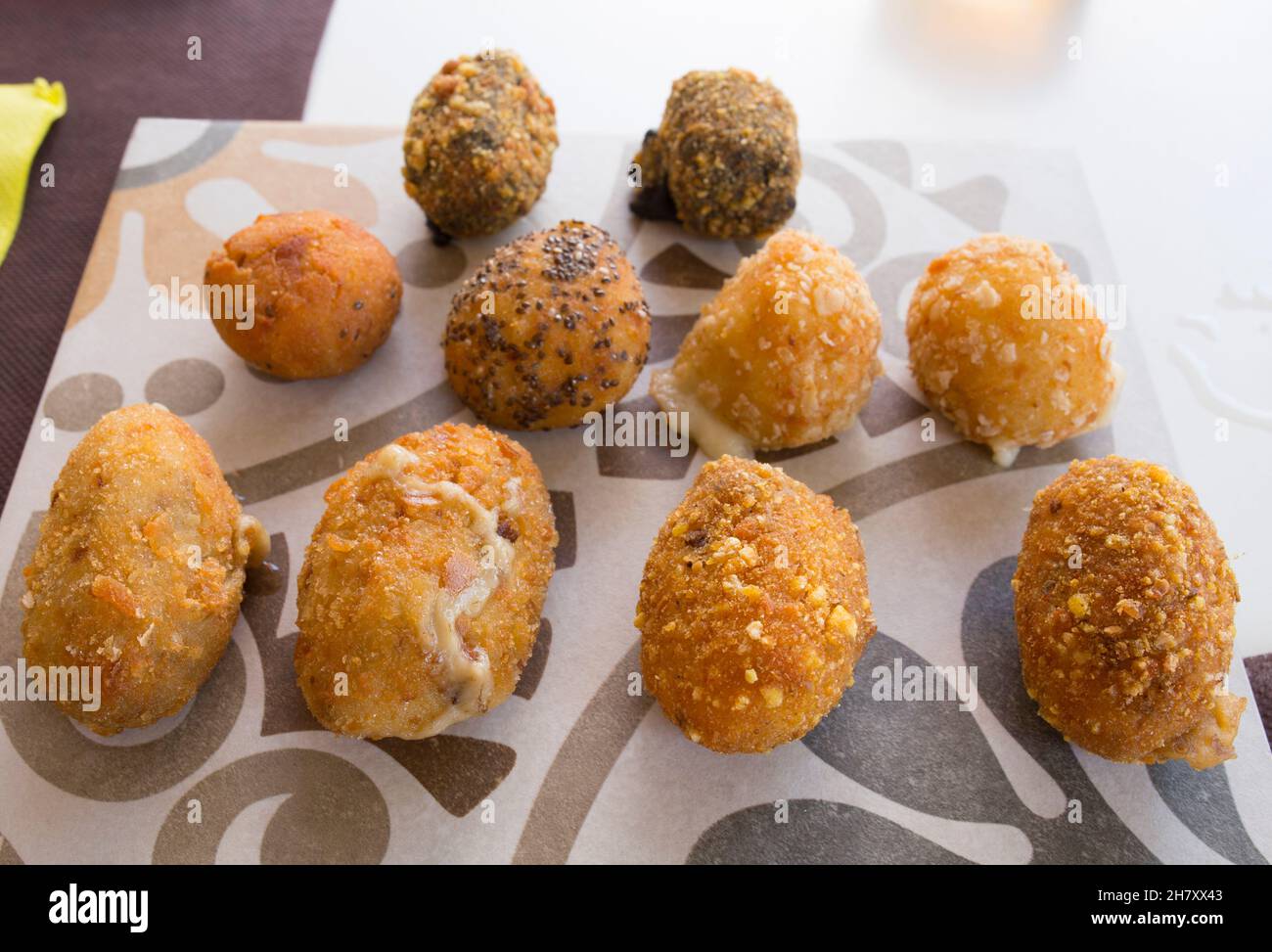 Assorted croquettes sauce served on cement tile. Selective focus Stock