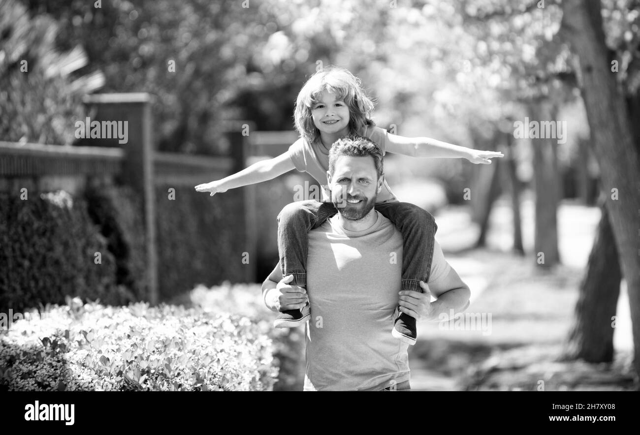 Happy Fathers day. Father piggyback son kid. Fathers day. Man give boy piggy ride Stock Photo