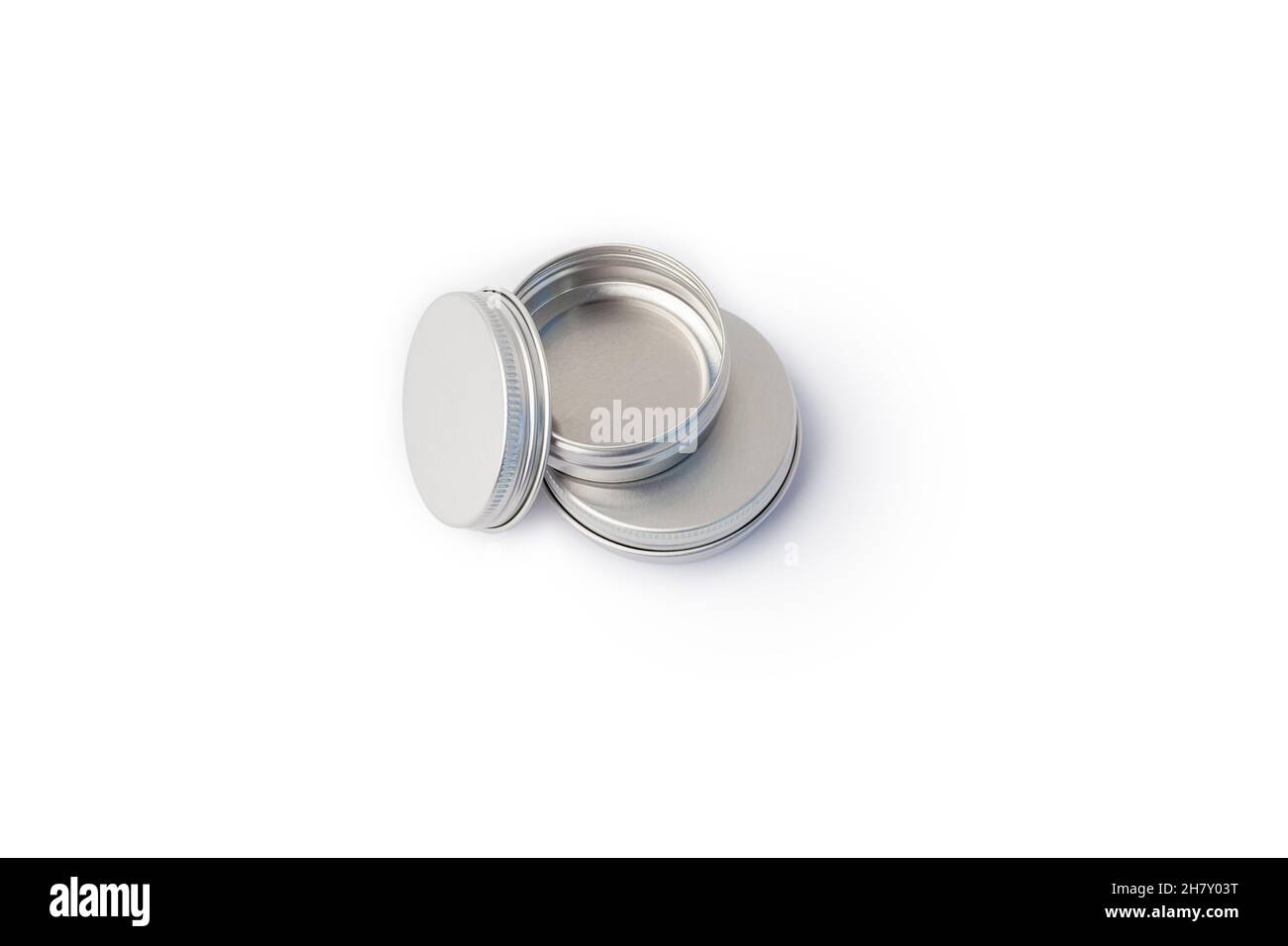 empty silver metal container for creme on white background Stock Photo