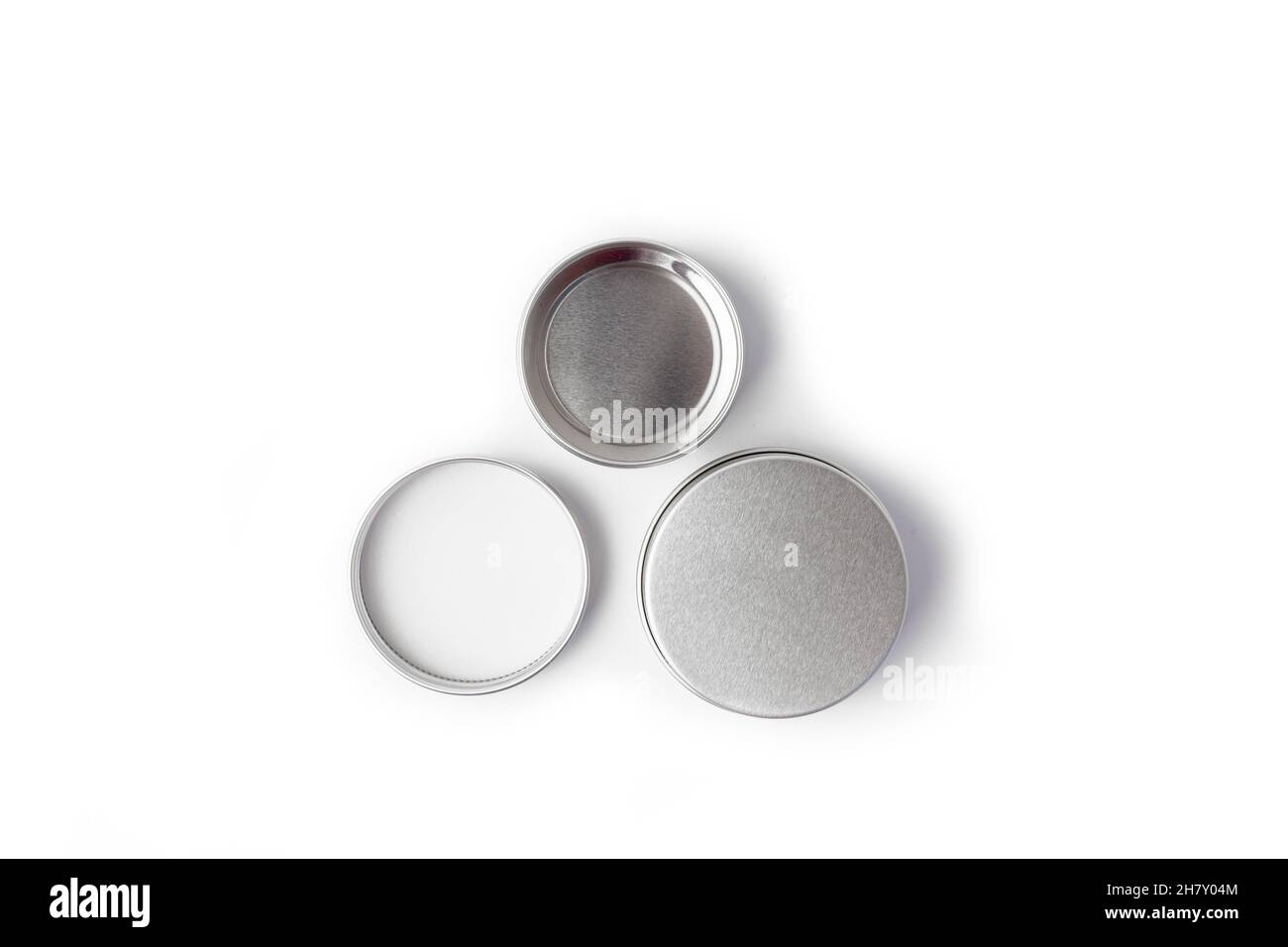 empty silver metal container for creme on white background Stock Photo
