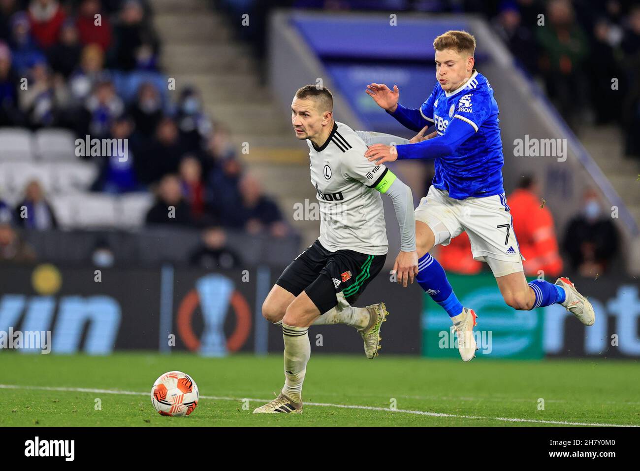 Harvey Barnes #7 of Leicester City cannot get past Artur Jedrzejczyk #55 of Legia Warsaw Stock Photo