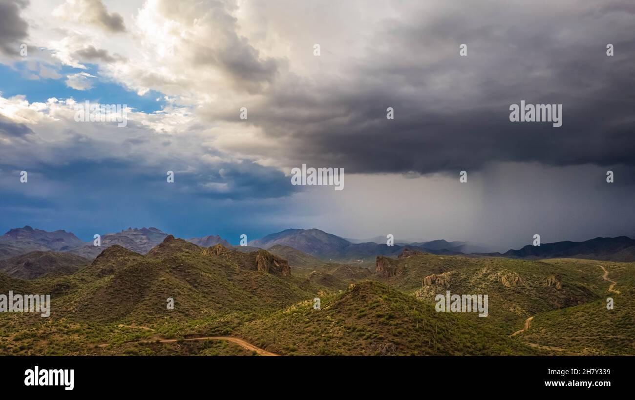 Aerial drone image of a monsoon over the Sonoran Desert of Arizona with rugged terrain. Stock Photo