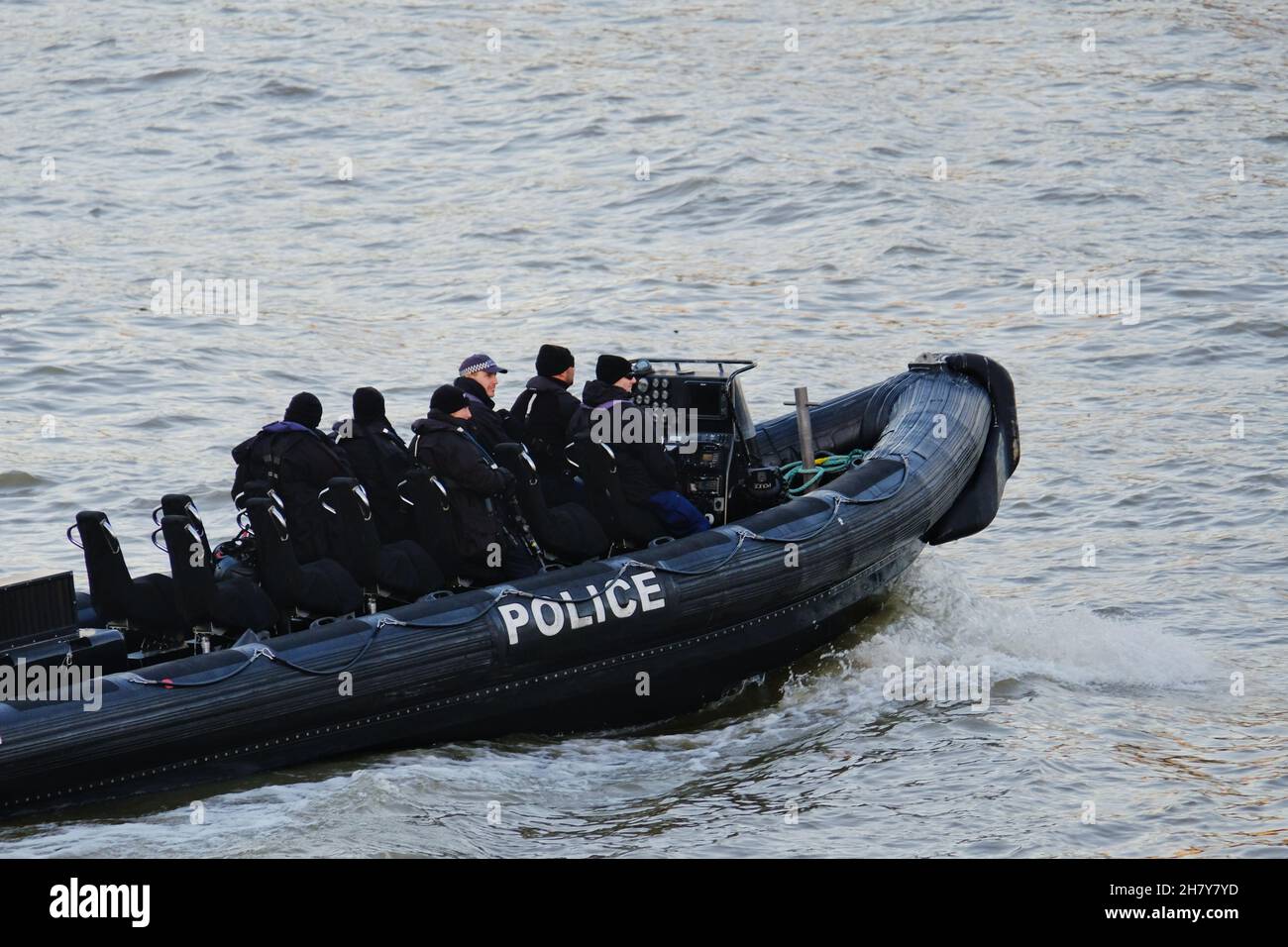 London, UK. A police boat patrols the River Thames as UK terrorism threat level is raised from substantial to severe after Liverpool taxi explosion. Stock Photo