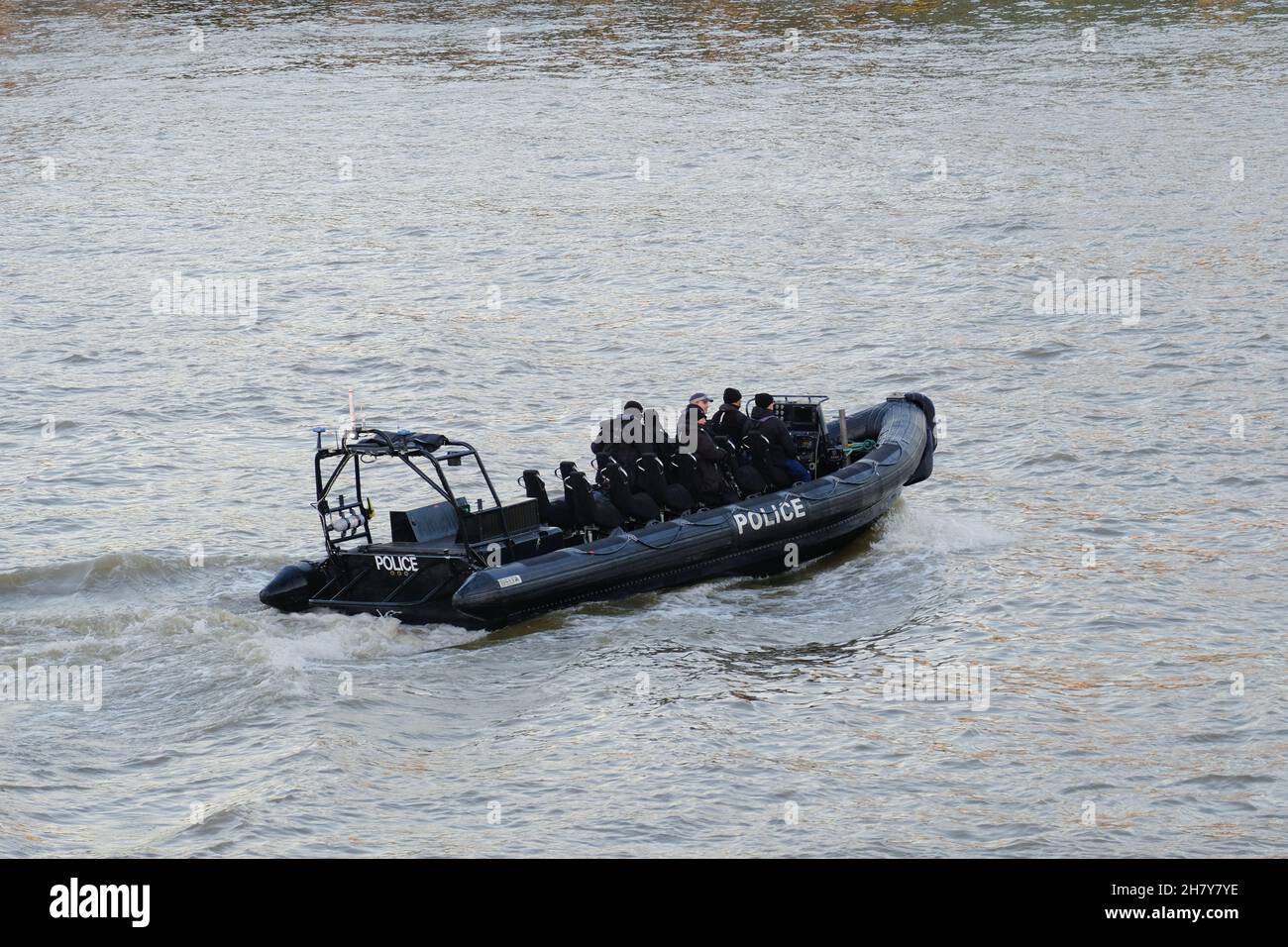 London, UK. A police boat patrols the River Thames as UK terrorism threat level is raised from substantial to severe after Liverpool taxi explosion. Stock Photo