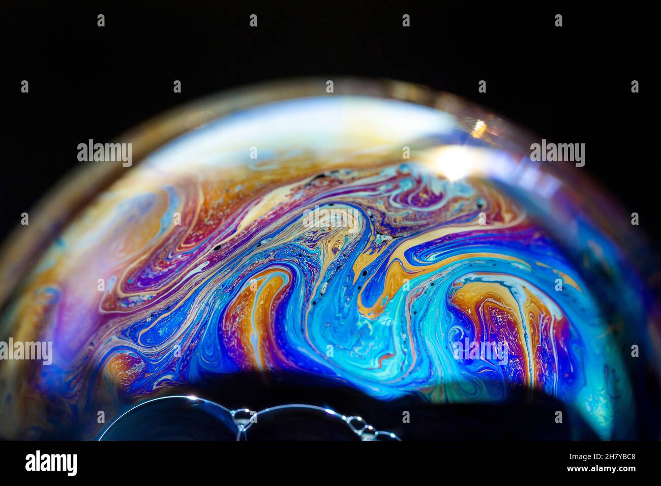 Abstract pattern, multicolored chaotic texture inside of the soap bubble, closeup Stock Photo