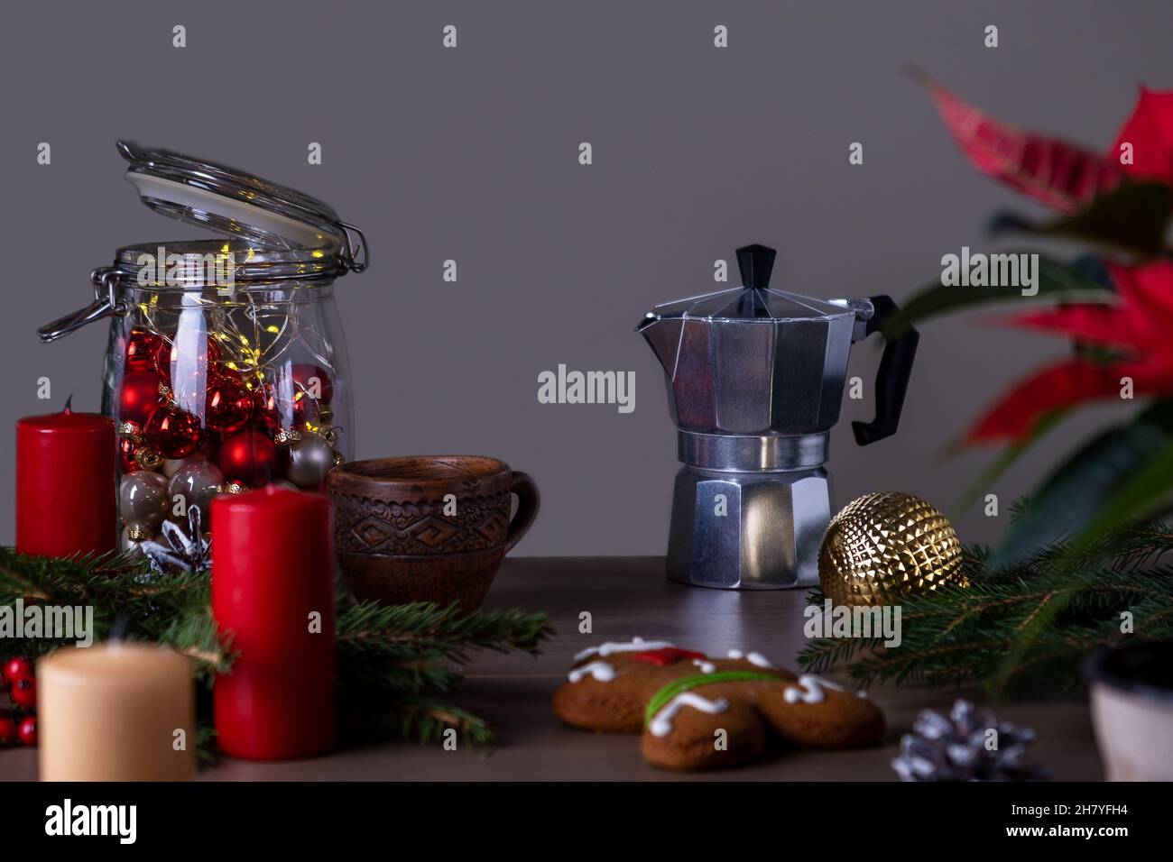 Christmas decor and geyser coffee maker with small ceramic cup. Stock Photo
