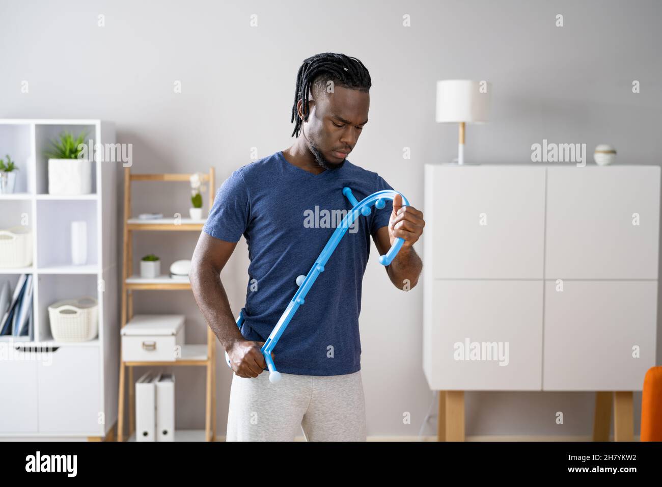 Man Using Muscle Hook For Trigger Point Massage Stock Photo Alamy